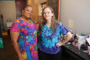 Elizabeth Cooper at Silo Art Studio with her SSA Rhonda Mallard. Young woman with her SSA Rhonda, standing in her kitchen