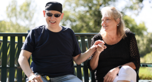 Jason, an adult who that receives Summit DD Services, with his disability provider.